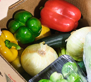 A box full of vegetables is packed and ready for pickup or delivery from Martinous Produce.